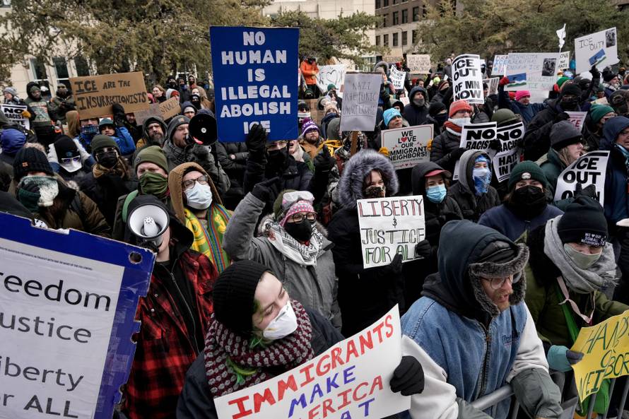 People attend the "March Against Minnesota Fraud" in Minneapolis