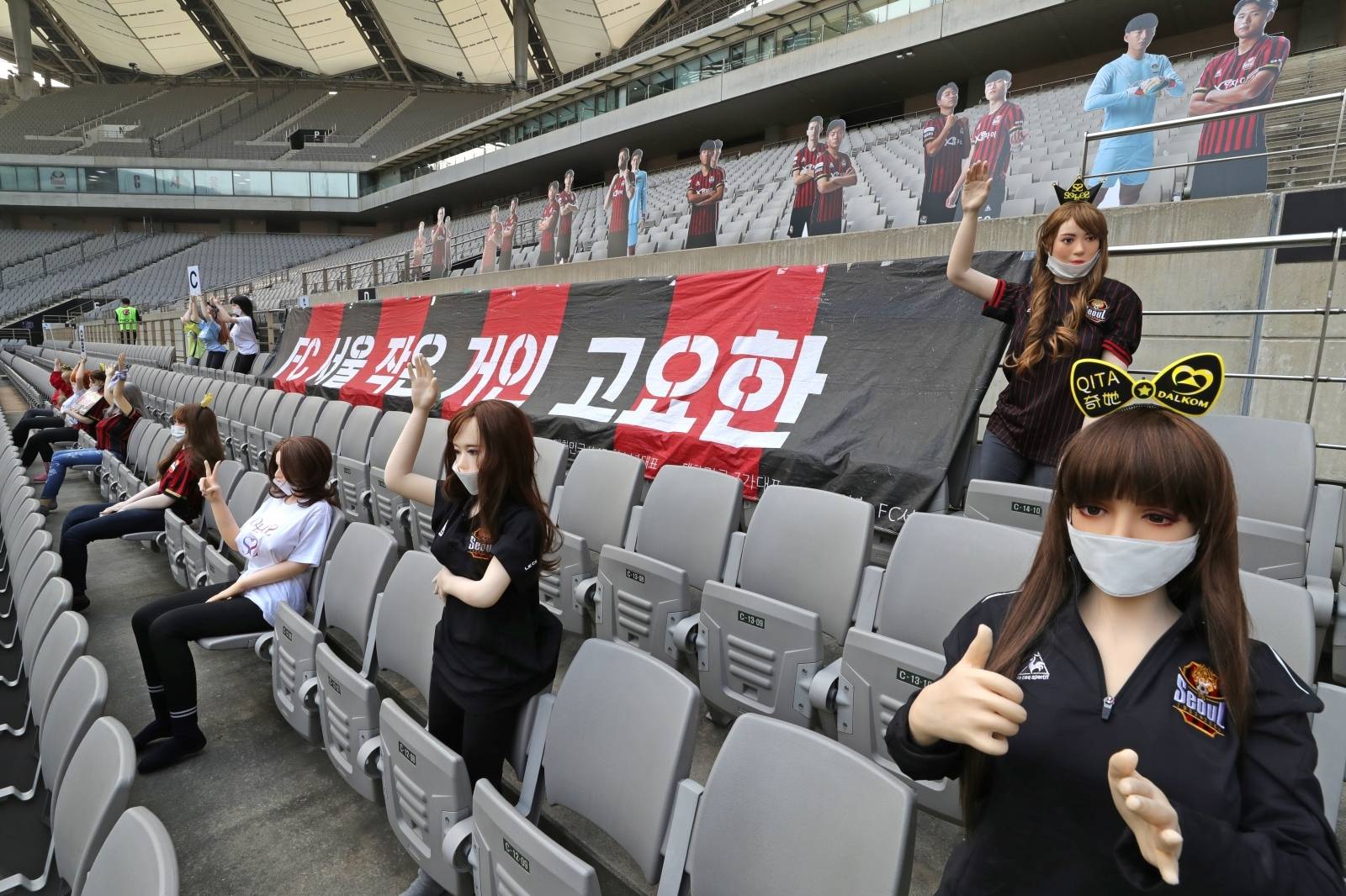 No spectators but cheering mannequins in football stands