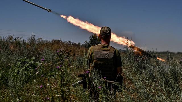 Ukrainian servicemen fire a Partyzan small MLRS toward Russian troops near a front line in Zaporizhzhia region