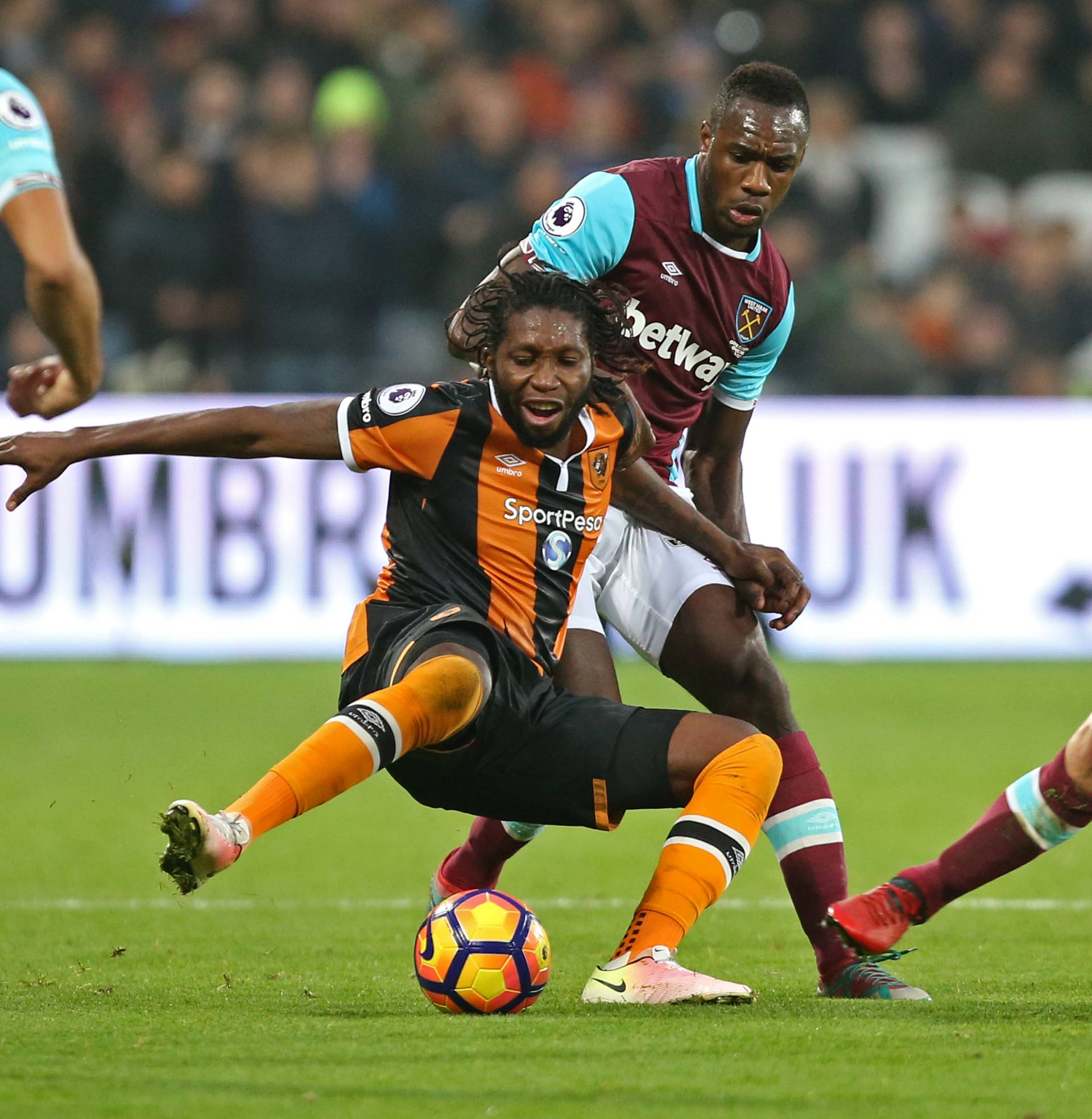 West Ham United's Mark Noble and Michail Antonio in action with Hull City's Dieumerci Mbokani