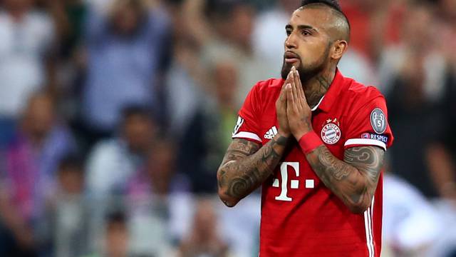 Bayern Munich's Arturo Vidal looks dejected after being sent off