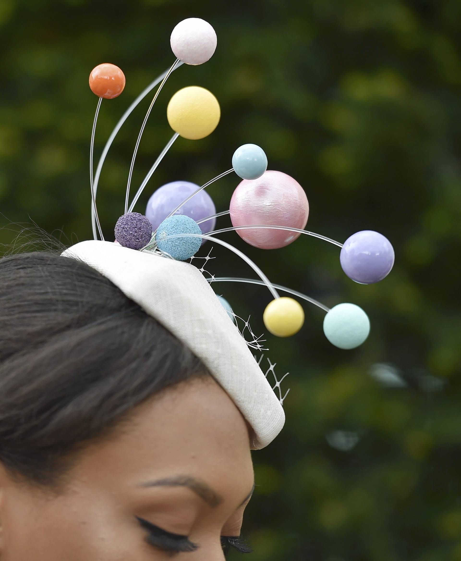 Britain Horse Racing Ladies Day Racegoer wears hat