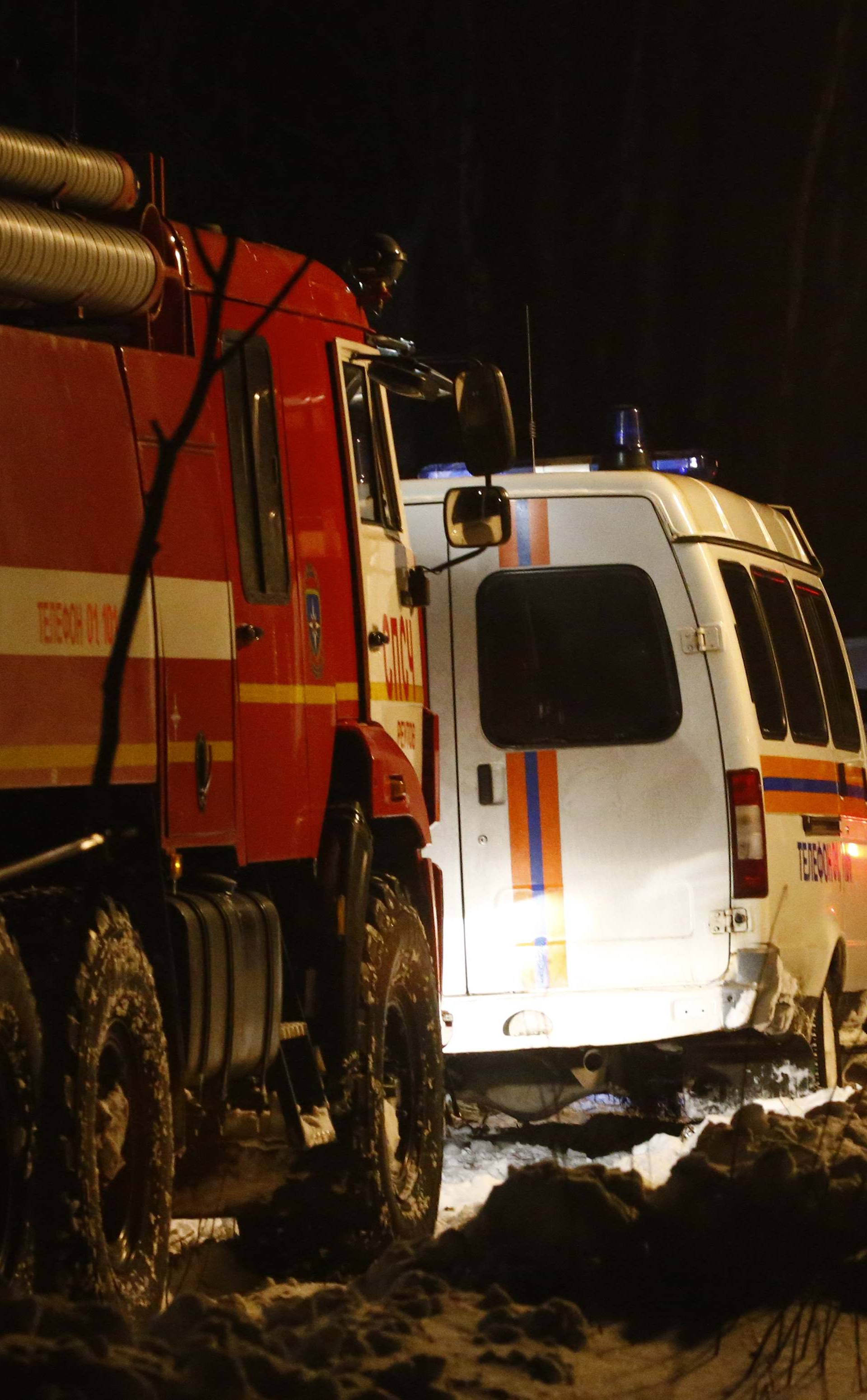 Emergency services work at the scene where a Saratov Airlines Antonov AN-148 plane crashed after taking off from Moscow's Domodedovo airport, outside Moscow