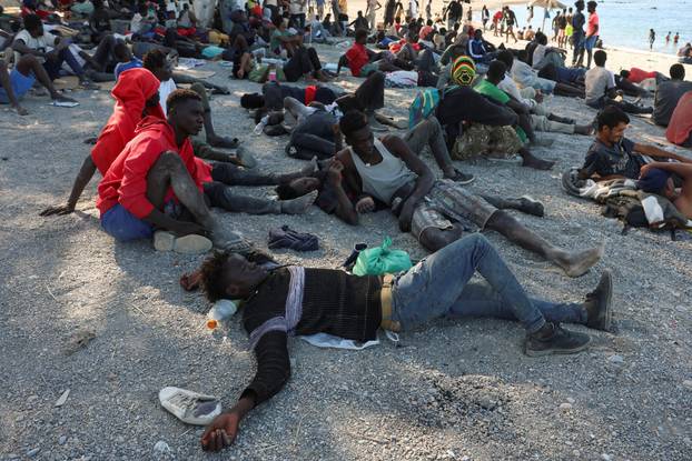 Mass crossings of migrants on foot and by sea from Morocco into Spanish territory, in Ceuta