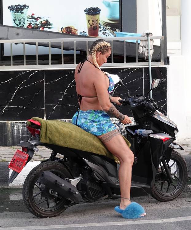*EXCLUSIVE* WEB MUST CALL FOR PRICING  - Wearing her furry blue slippers and showing off the results of her biggest EVER boob job in her sexy multicoloured bikini, the British Glamour Model Katie Price is pictured enjoying her holiday in Thailand.*PICTUR