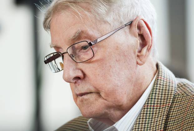 Defendant Hanning, a 94-year-old former guard at Auschwitz death camp, sits in a courtroom before the continuation of his trial in Detmold