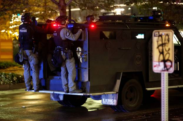Police officers respond to a protest march that took place on Election Day in Seattle