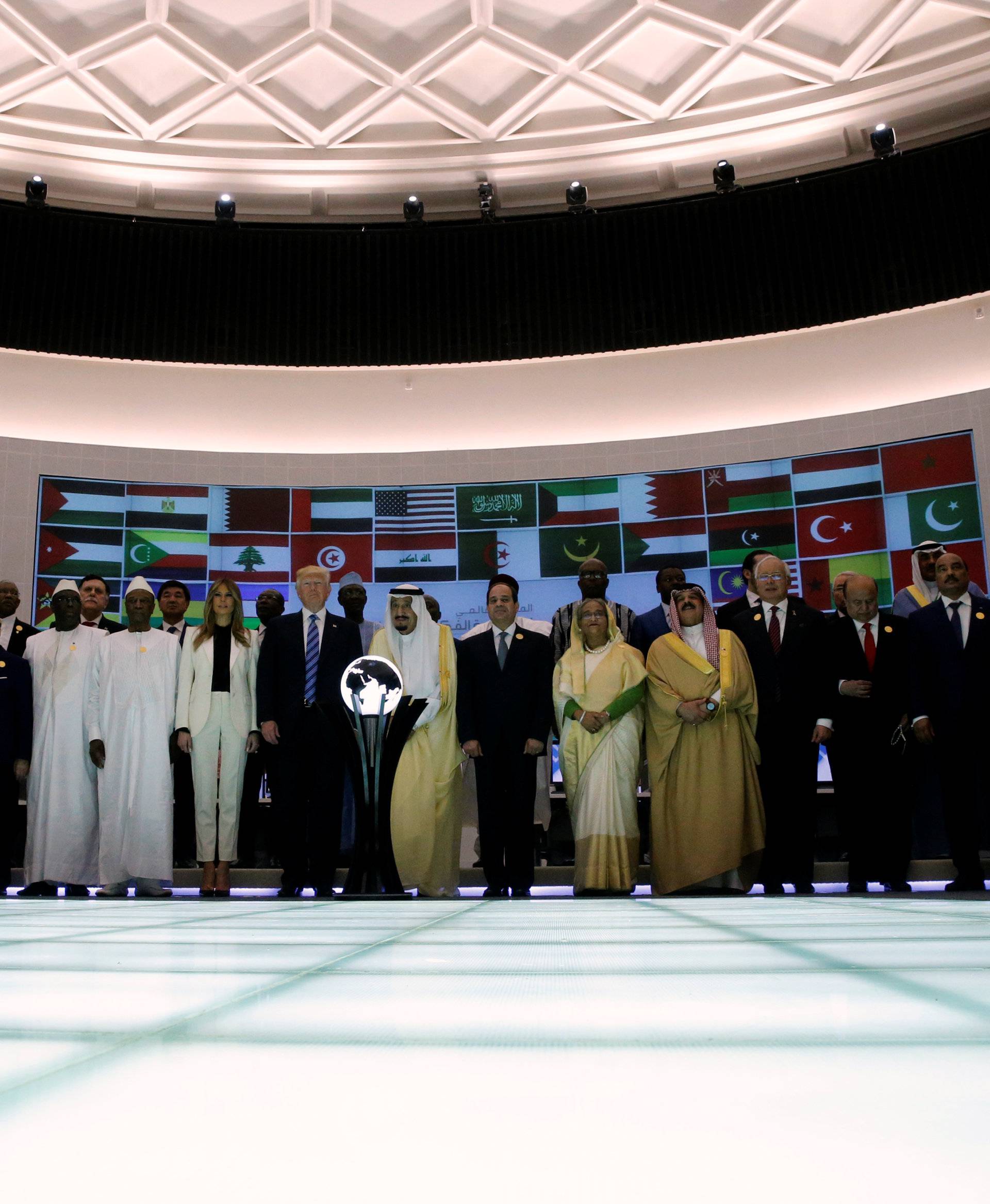 Trump, Saudi Arabia's King Salman and other leaders stand for a family photo at the new Global Center for Combatting Extremist Ideology in Riyadh, Saudi Arabia