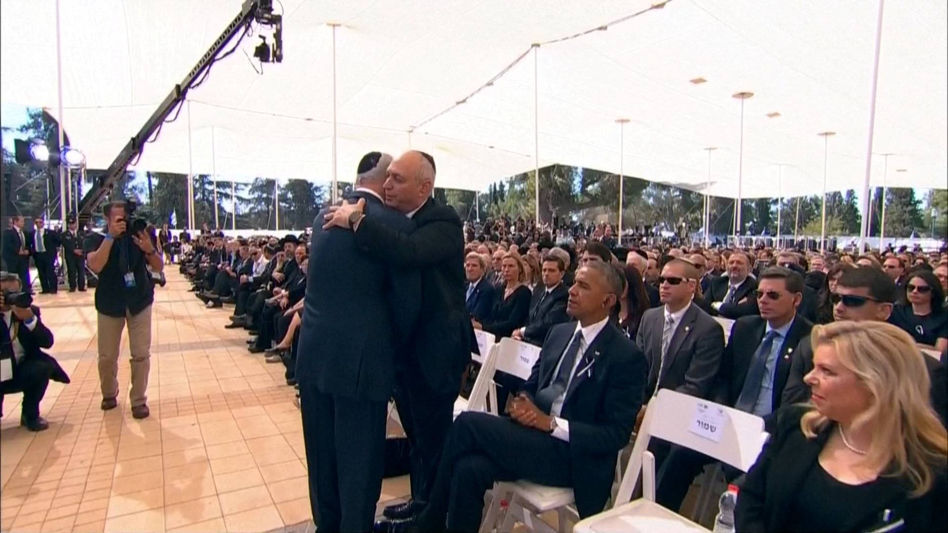  A still image from a video shows Israel's PM Netanyahu embracing Chemi Peres, the son former Israeli President Shimon Peres, at the funeral in Jerusalem 