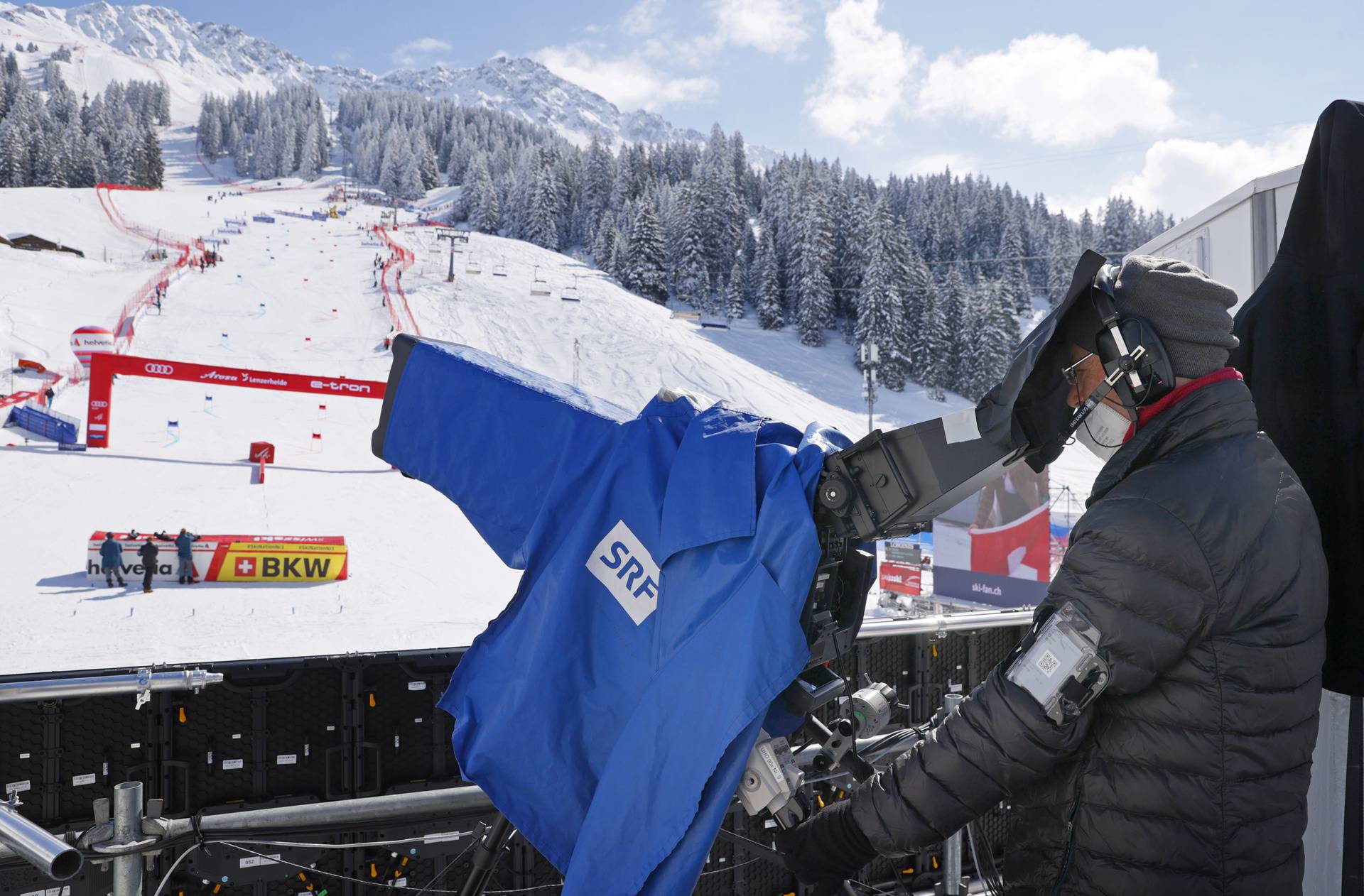 A cameraman of Schweizer Radio and Fernsehen (SRF RTS TV) films the Alpine Skiing World Cup final in Lenzerheide