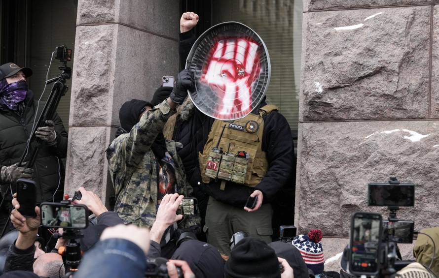 People attend the "March Against Minnesota Fraud" in Minneapolis