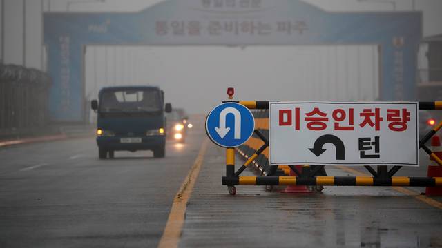 A traffic sign is seen on the Grand Unification Bridge which leads to the truce village Panmunjom, just south of the demilitarized zone separating the two Koreas, in Paju
