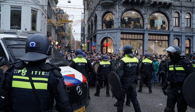 Pro-Palestinian protesters take part in a banned demonstration in Amsterdam