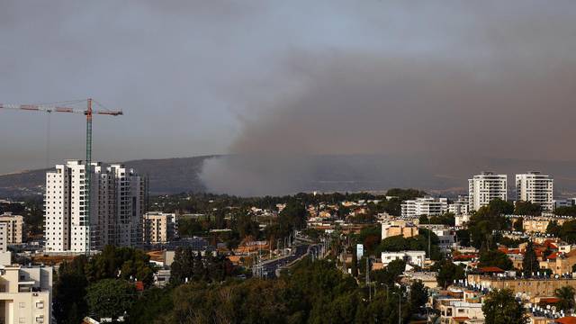 Smoke rises above Israel's border with Lebanon, as seen from Nahariya