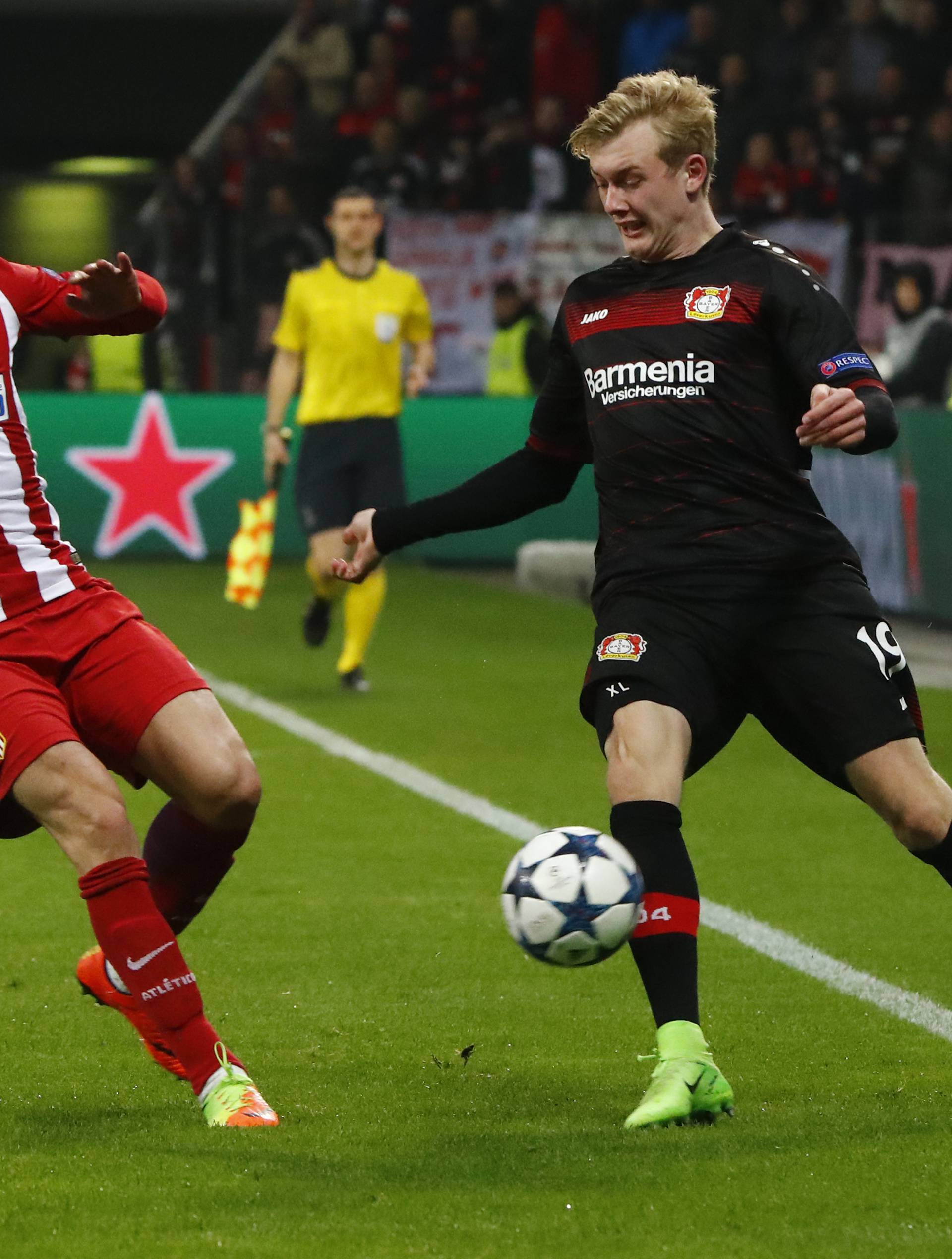 Bayer Leverkusen's Julian Brandt in action with Atletico Madrid's Sime Vrsaljko