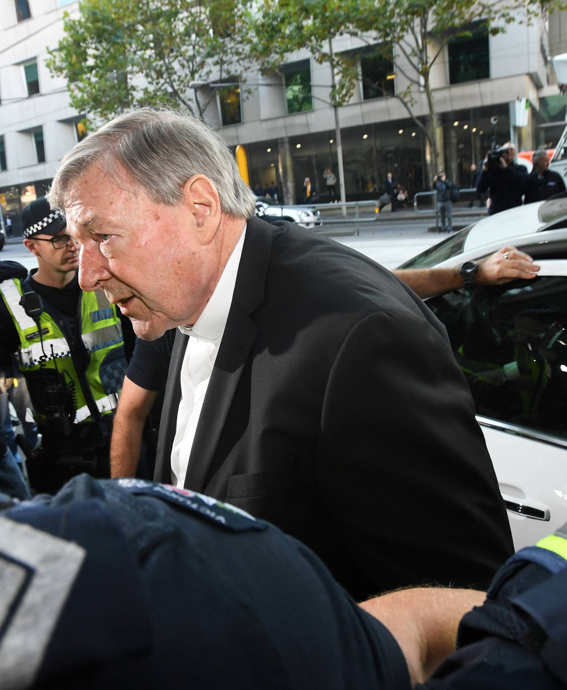 Cardinal George Pell arrives at the Melbourne Magistrates Court in Melbourne