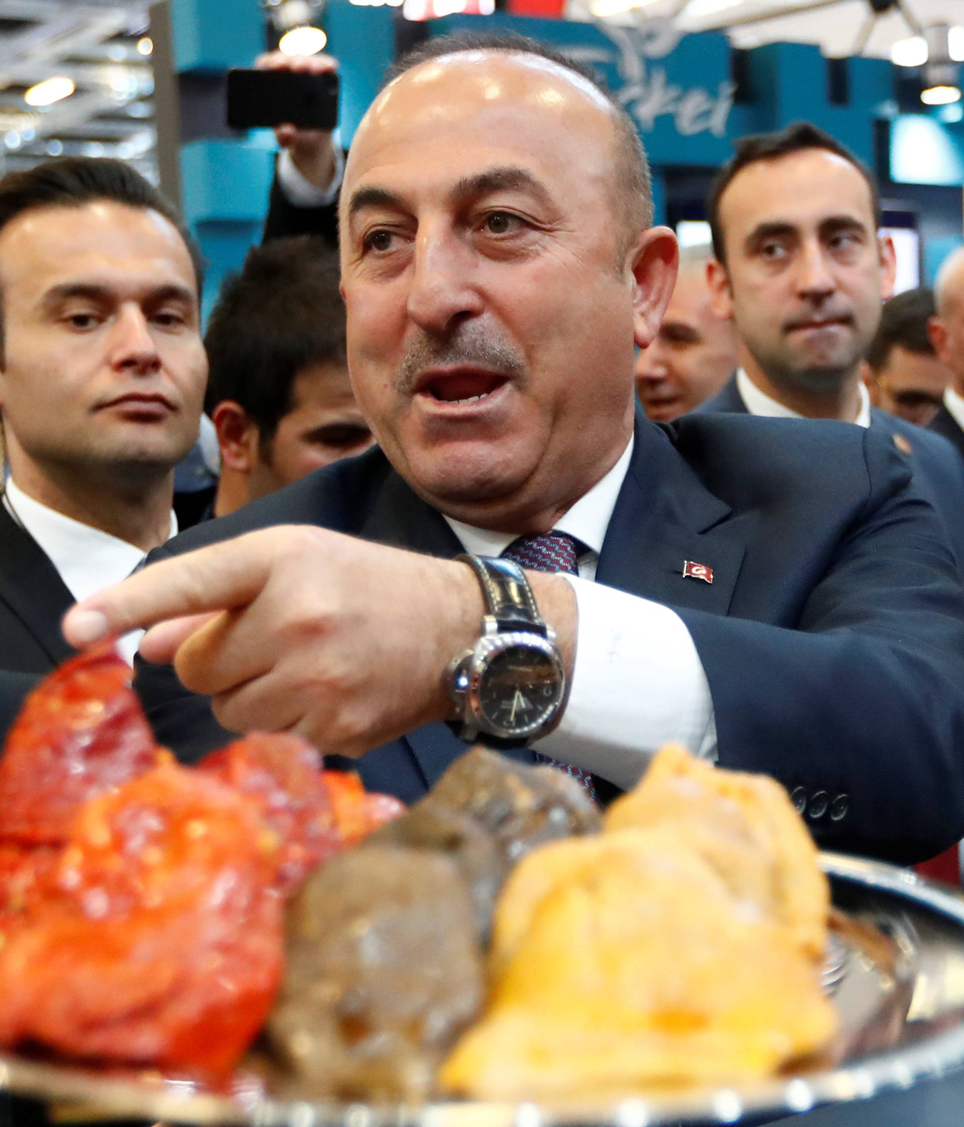 FILE PHOTO: Turkey's Minister for Culture and Tourism Avci and Turkish FM Cavusoglu at the International Tourism Trade Fair ITB in Berlin