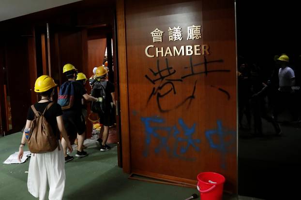 Graffiti left by anti-extradition bill protesters as they break into the Legislative Council building during the anniversary of Hong Kong