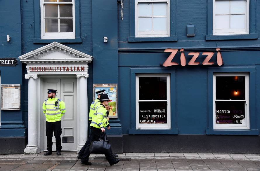 A police officer stands outside a restaurant which was closed after former Russian inteligence officer Sergei Skripal, and a woman were found unconscious on a bench nearby after they had been exposed to an unknown substance, in Salisbury