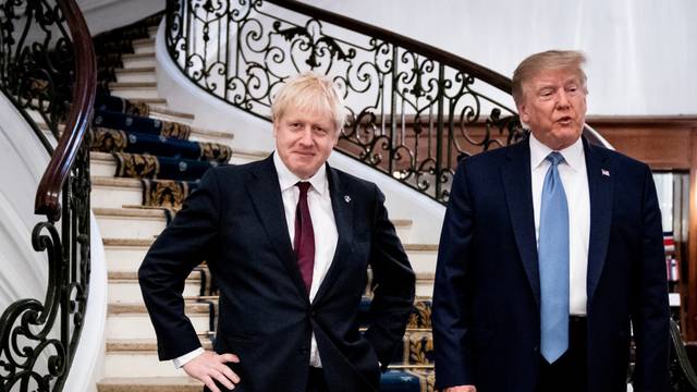 FILE PHOTO: U.S. President Donald Trump and Britain's Prime Minister Boris Johnson arrive for a bilateral meeting during the G7 summit in Biarritz, France