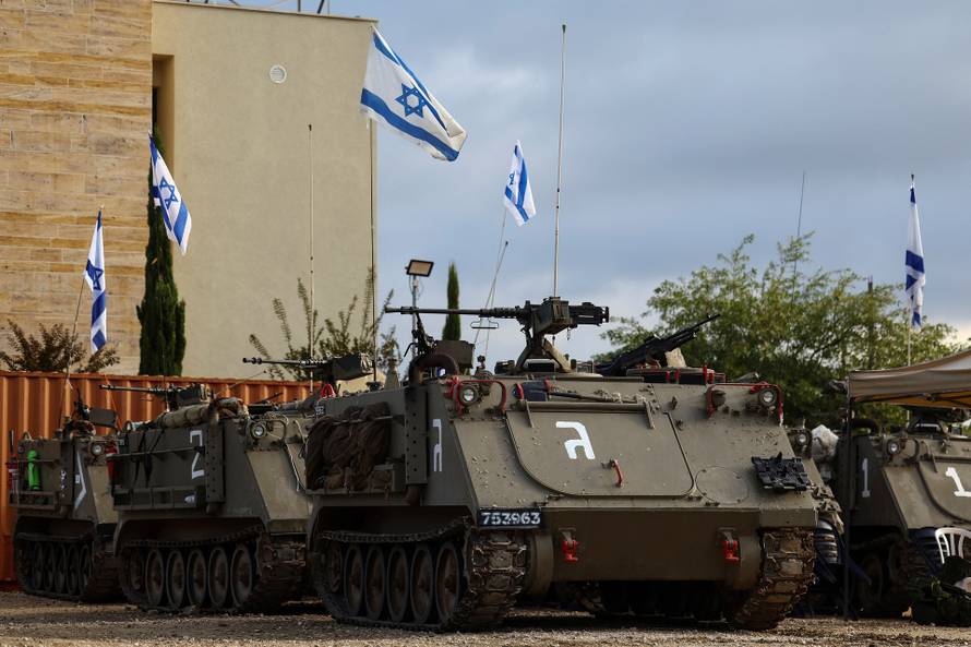 Israeli military APCs in position near Israel's border with Lebanon in northern Israel