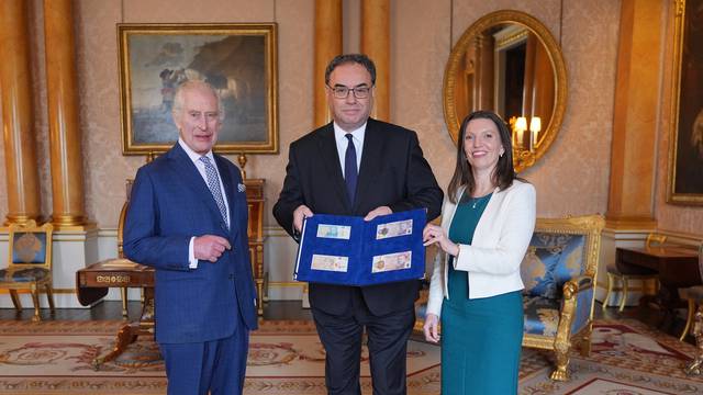 King Charles is presented with the first bank notes featuring his portrait in London