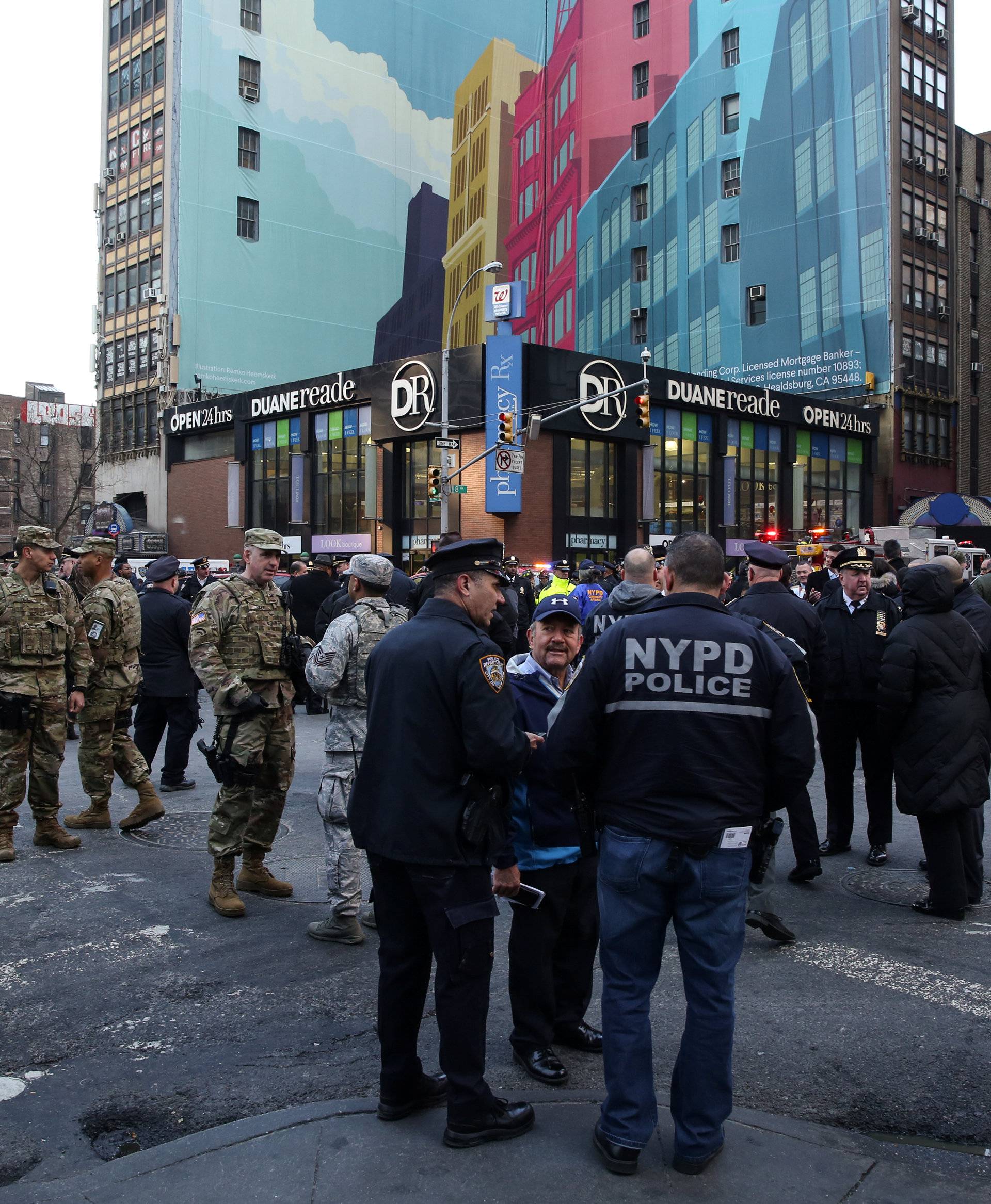 New York Police Department (NYPD) officers stand guard near Port Authority Bus Terminal after reports of an explosion in New York