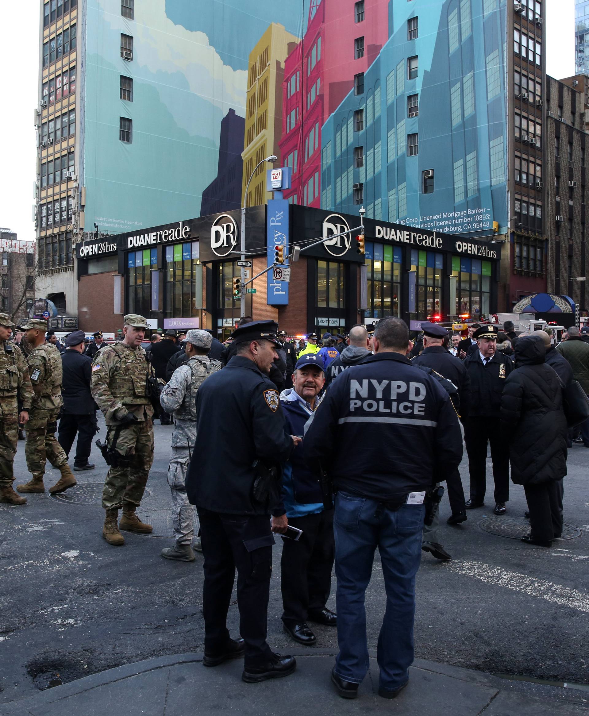 New York Police Department (NYPD) officers stand guard near Port Authority Bus Terminal after reports of an explosion in New York