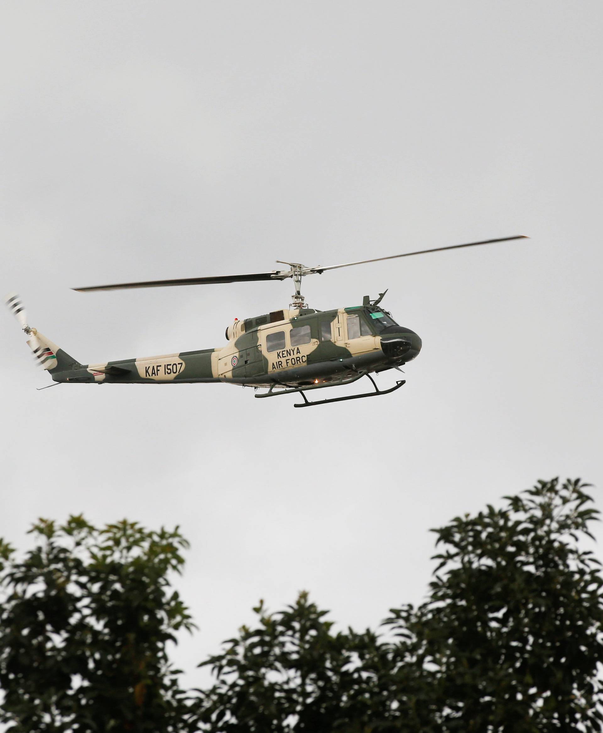 A Kenyan air force helicopter flies over the scene where explosions and gunshots were heard at the Dusit hotel compound, in Nairobi