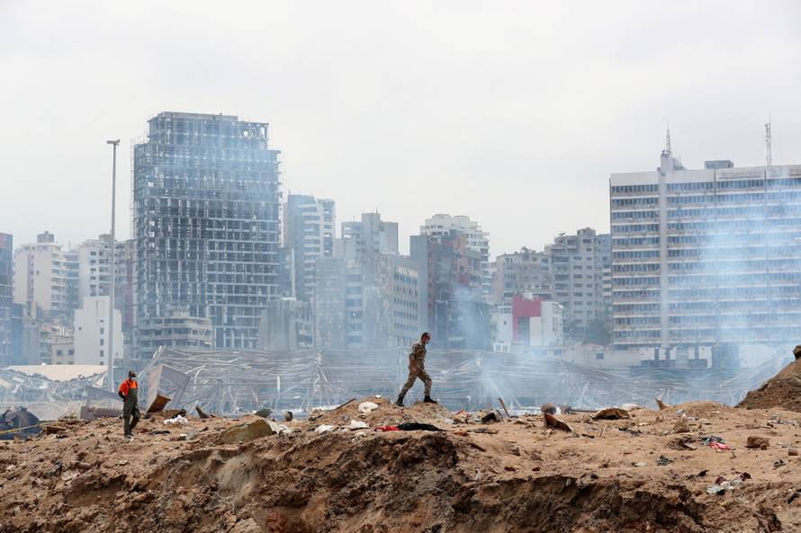 A soldier walks at the devastated site of the explosion at the port of Beirut