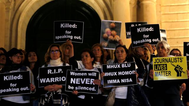 Protestors stand outside the Auberge de Castille, the office of Prime Minister Muscat, at the start of a four-day protest against the assassination of investigative journalist Daphne Caruana Galizia, in Valletta