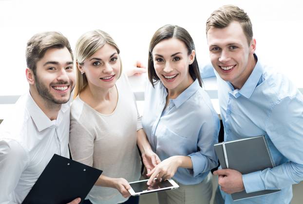 Pleasant office workers bonding to each other