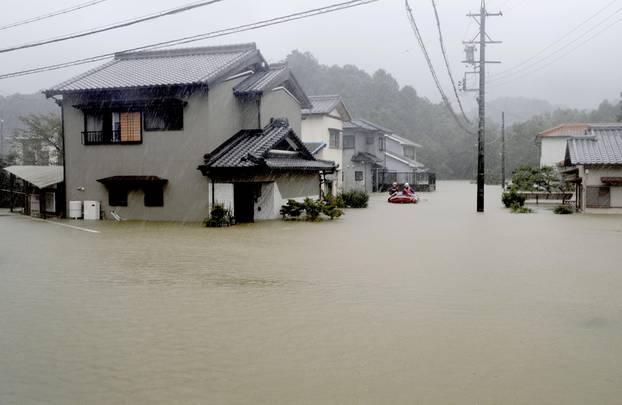 Heavy rains caused by Typhoon Hagibis flood a residential area in Ise