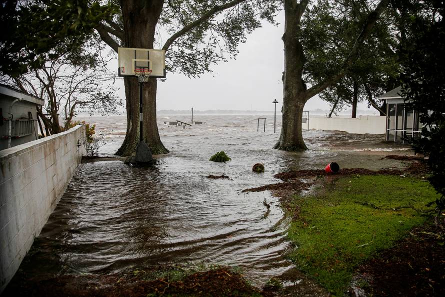 FILE PHOTO: Water from Neuse River starts flooding houses as the Hurricane Florence comes ashore in New Bern North Carolina