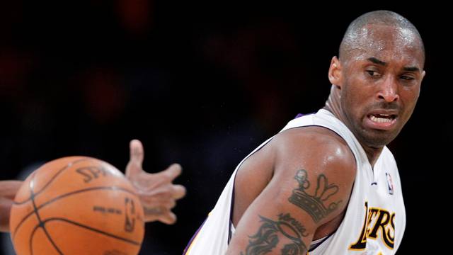 FILE PHOTO: Lakers' Bryant loses control of the ball during Game 1 of their NBA Western Conference game against the Hornets in Los Angeles