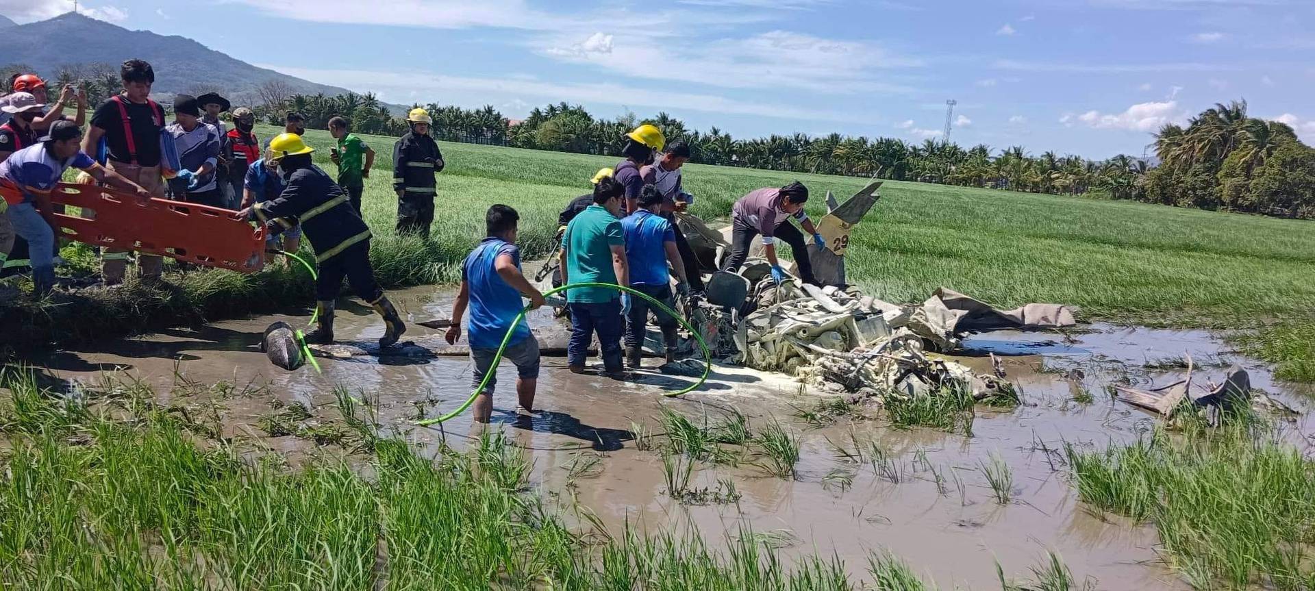 Rescuers retrieve bodies of two Philippine military pilots following crash