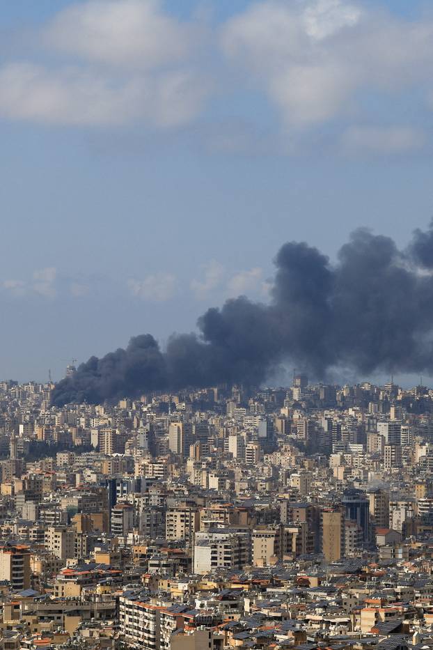 Smoke rises following an Israeli strike on the southern suburbs of Beirut