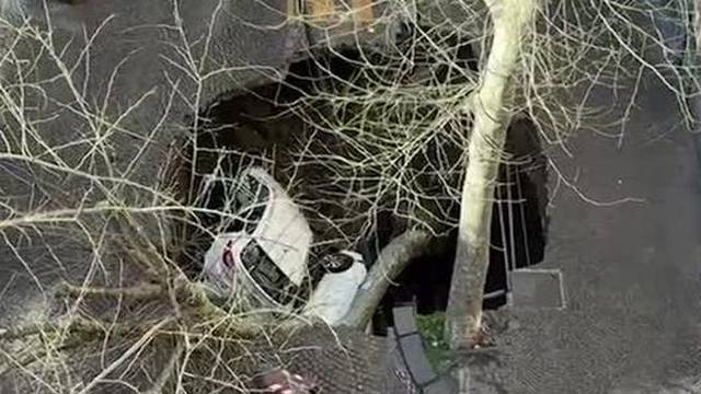 Two cars swallowed in Naples sinkhole