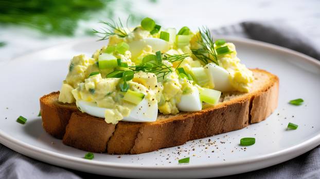 Boiled eggs with dill and mayonnaise on toast.
