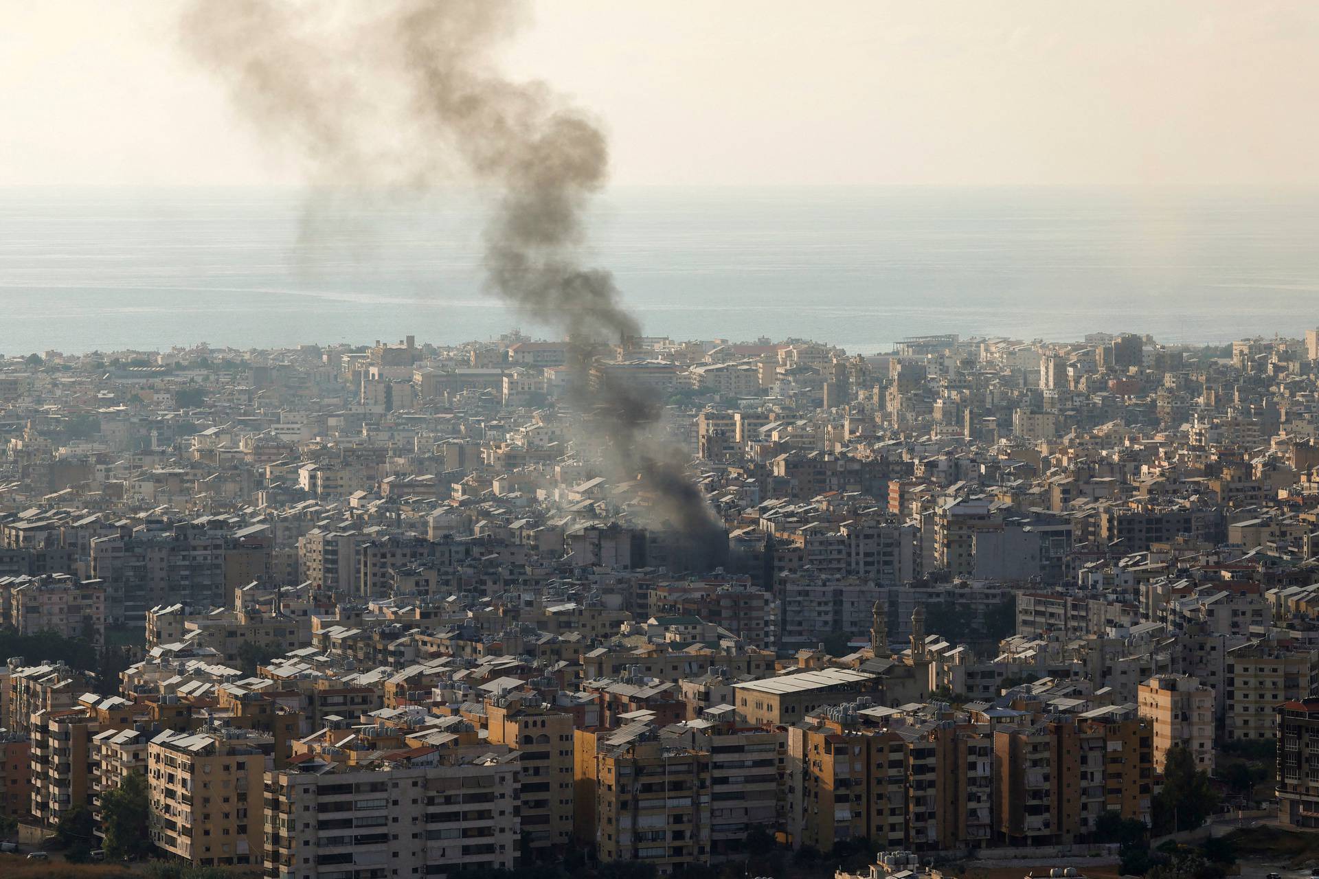 Smoke rises over Beirut's southern suburbs from generator fire, according to residents