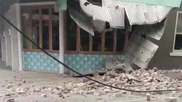 Debris and a damaged building are seen in Prahran, after a magnitude 6.0 earthquake struck near Melbourne, Victoria, Australia