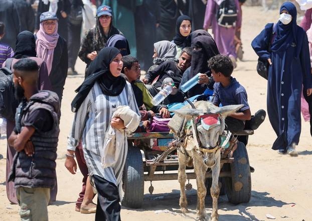 Palestinians seek aid from the U.S.-backed Gaza Humanitarian Foundation, near Rafah