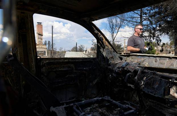 Luke Opperman at his burned home at Hawk Fire in Reno