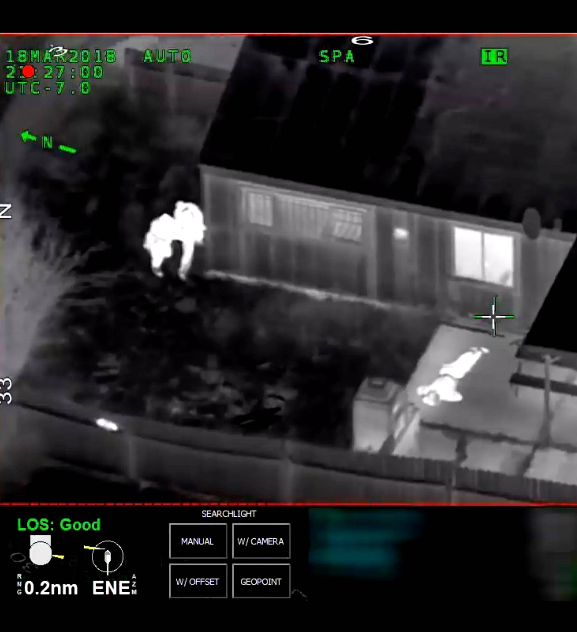 Stephon Clark is visible on the ground after two police officers shot him, in this still image captured from police aerial video by Sacramento Police Department