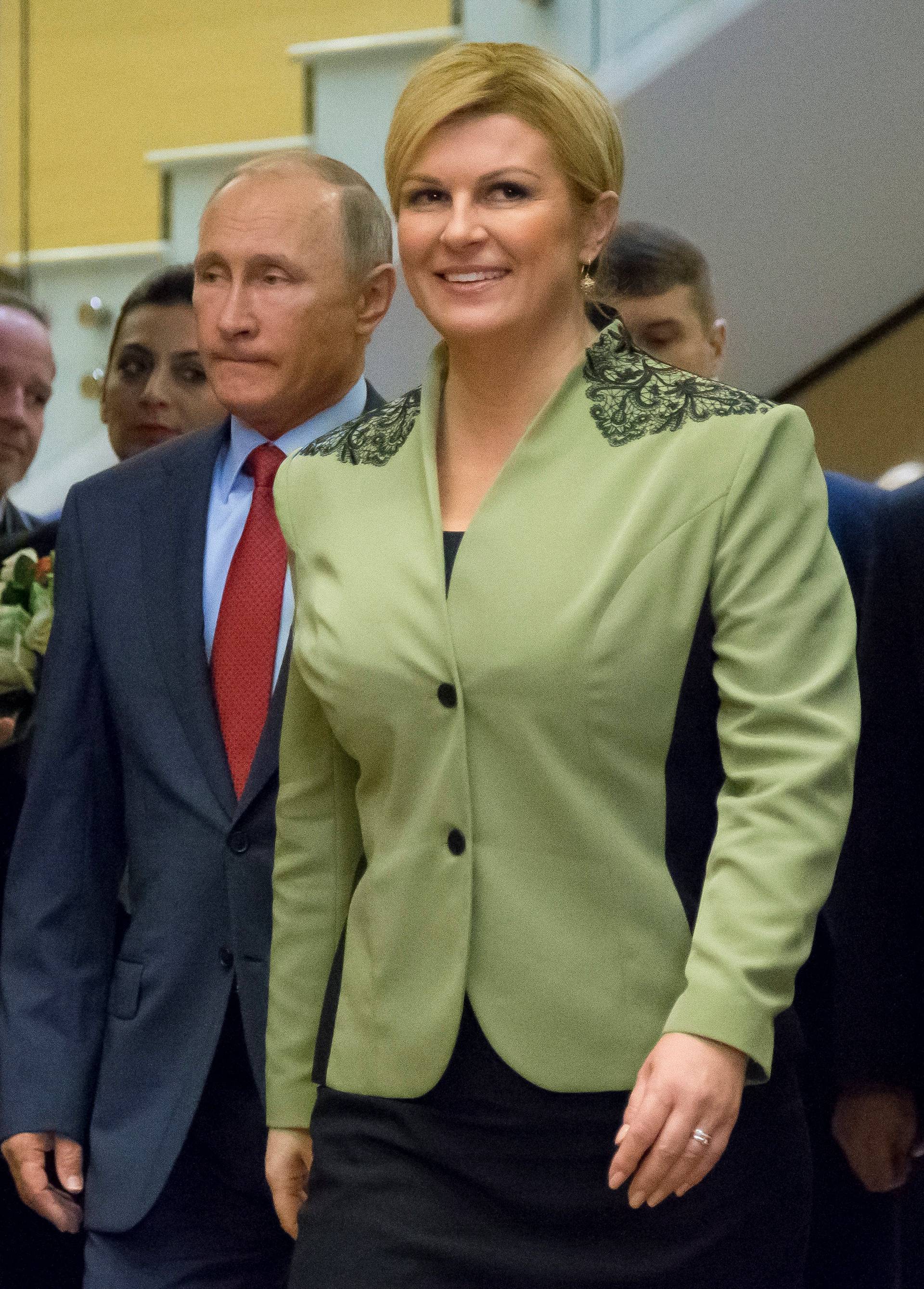 Croatian President Grabar-Kitarovic and Russia's Putin enter hall for their talks in Sochi