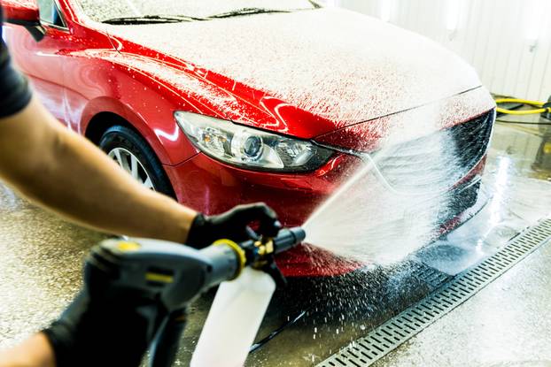 Worker,Washing,Car,With,Active,Foam,On,A,Car,Wash.