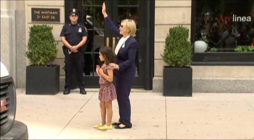 U.S. Democratic presidential nominee Hillary Clinton greets a girl on the sidewalk after leaving her daughter Chelsea's home in New York