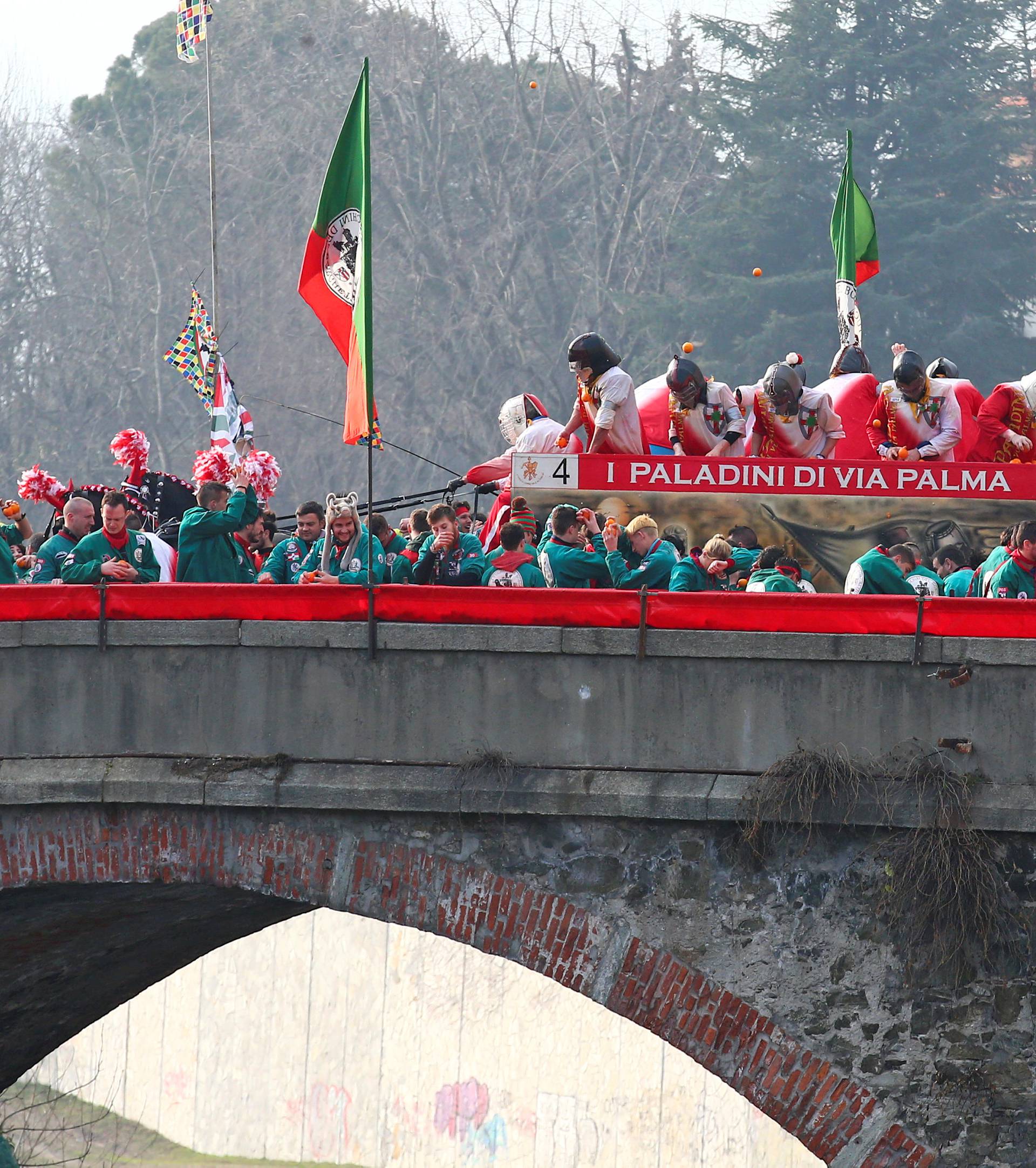 Members of rival teams fight with oranges during an annual carnival battle in the northern Italian town of Ivrea