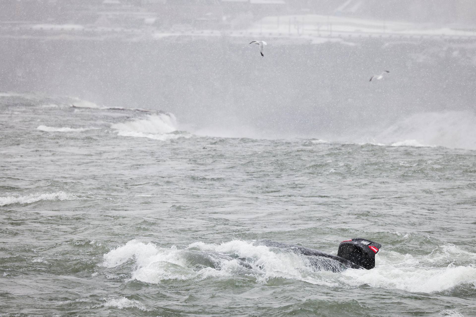 Car in rapids near edge of American Falls in Niagara Falls, New York