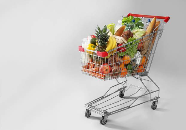 Shopping,Cart,Full,Of,Groceries,On,Grey,Background.,Space,For